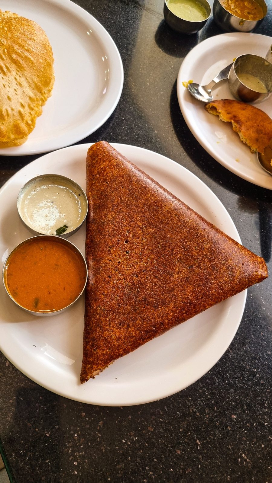Crispy dosa served with chutney and sambar