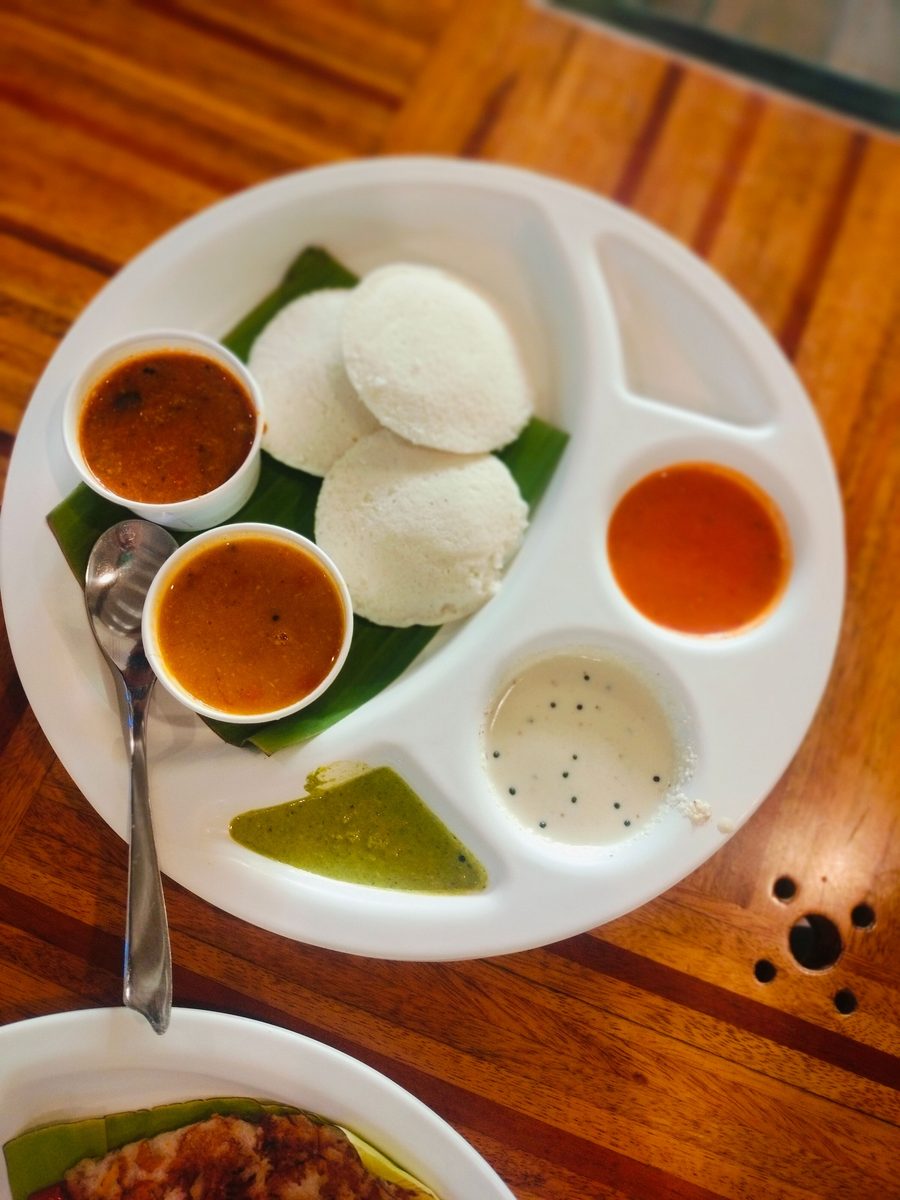 Soft idly with sambar and chutneys